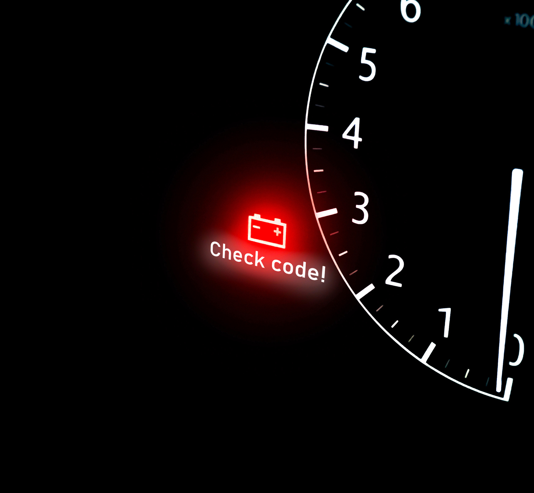 Battery warning light on car dashboard